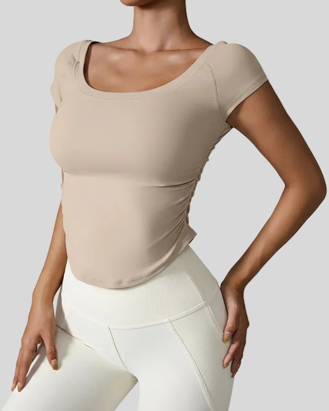 StudioFlow Short Sleeve Active Top in tan, front view with fitted silhouette