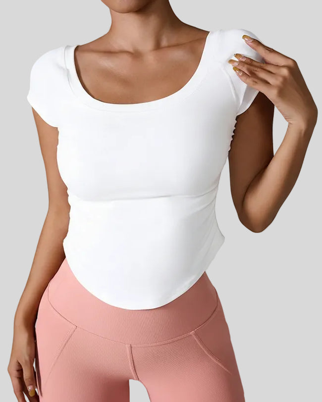 StudioFlow Short Sleeve Active Top in white, front view with fitted silhouette
