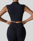 StudioLine High-Neck Tank in black, back view showing minimalist cropped silhouette