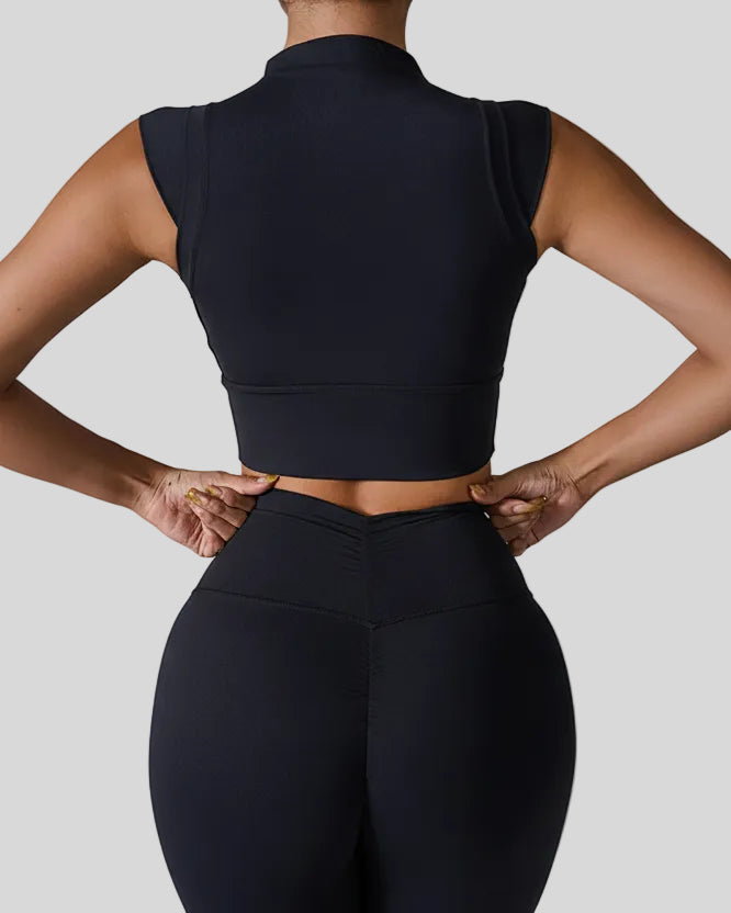 StudioLine High-Neck Tank in black, back view showing minimalist cropped silhouette