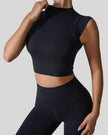 StudioLine High-Neck Tank black, angled view highlighting clean arm openings and smooth fabric