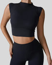 StudioLine High-Neck Tank in black, front view showing cropped fit and high neckline