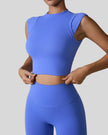 StudioLine High-Neck Tank blue, angled view highlighting clean arm openings and smooth fabric