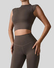 StudioLine High-Neck Tank in camel, front angle view showing minimalist cropped silhouette
