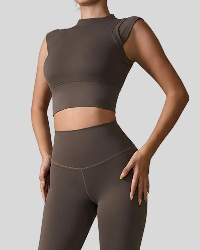 StudioLine High-Neck Tank in camel, front angle view showing minimalist cropped silhouette