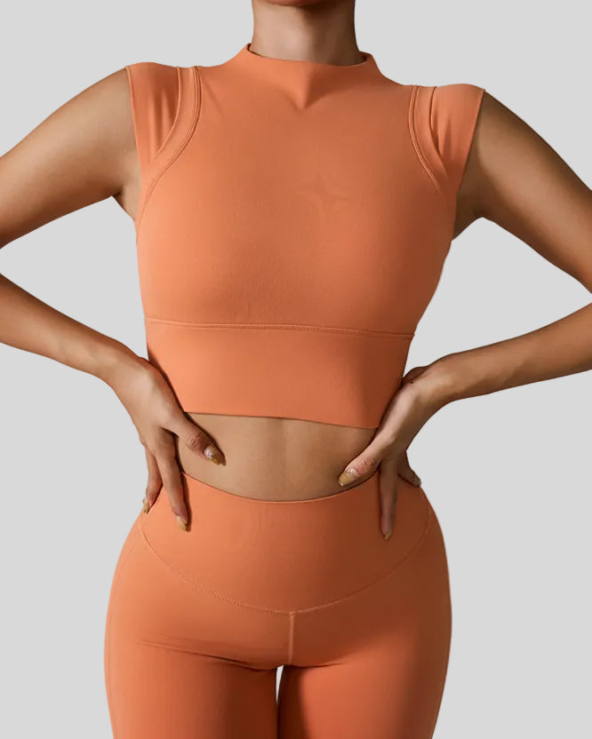 StudioLine High-Neck Tank in caramel, front view showing cropped fit and high neckline