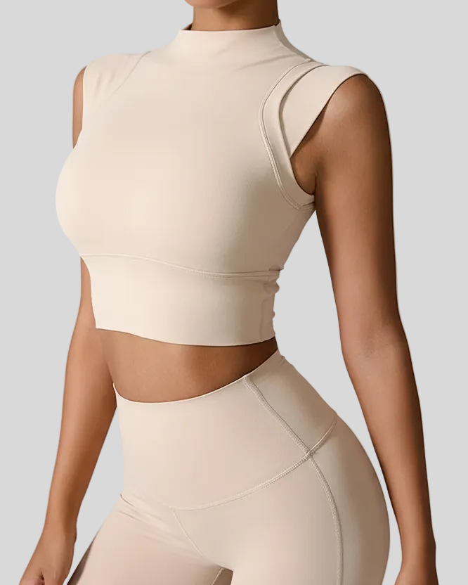 Tan sleeveless top and leggings set on a gray background