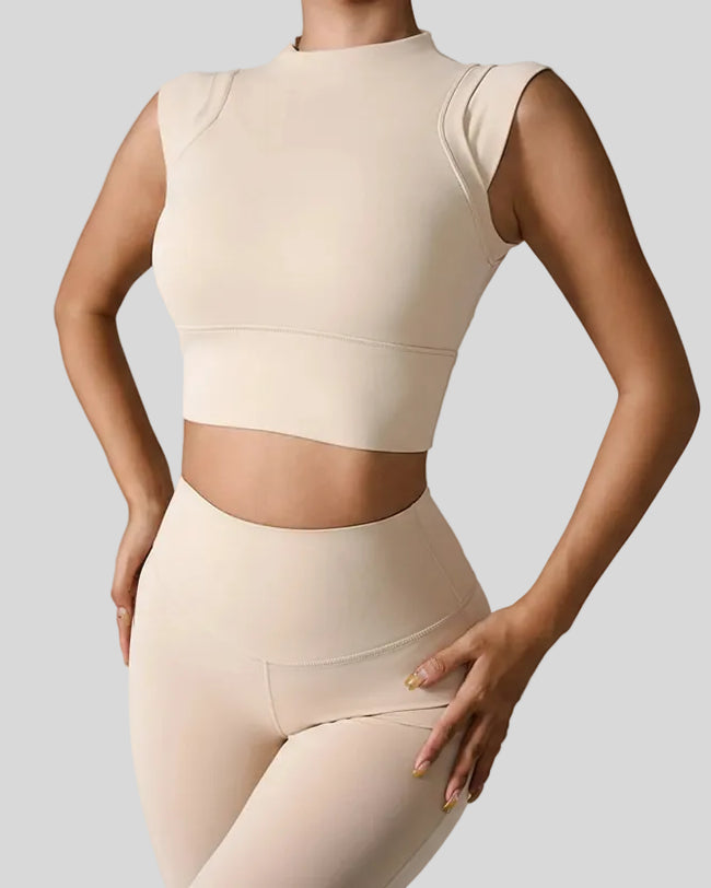 StudioLine High-Neck Tank in tan, front view showing cropped fit and high neckline