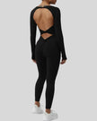StudioTwist open-back jumpsuit in black showing twisted back design