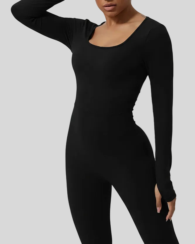 Close-up of Athlesi StudioTwist Open  Back Jumpsuit fabric and waistline detail in black