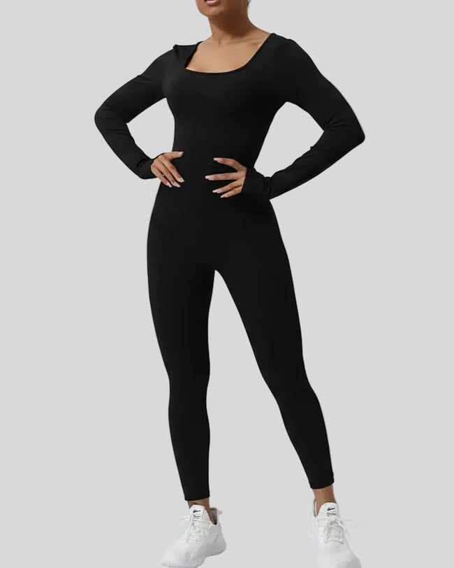 StudioTwist open-back long sleeve jumpsuit in black, front view