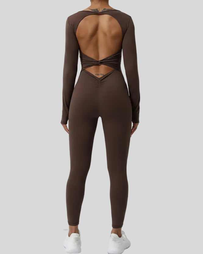 StudioTwist open-back jumpsuit in chocolate showing twisted back design
