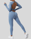StudioTwist open-back jumpsuit in light blue showing twisted back design