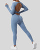 StudioTwist open-back jumpsuit in light blue showing twisted back design