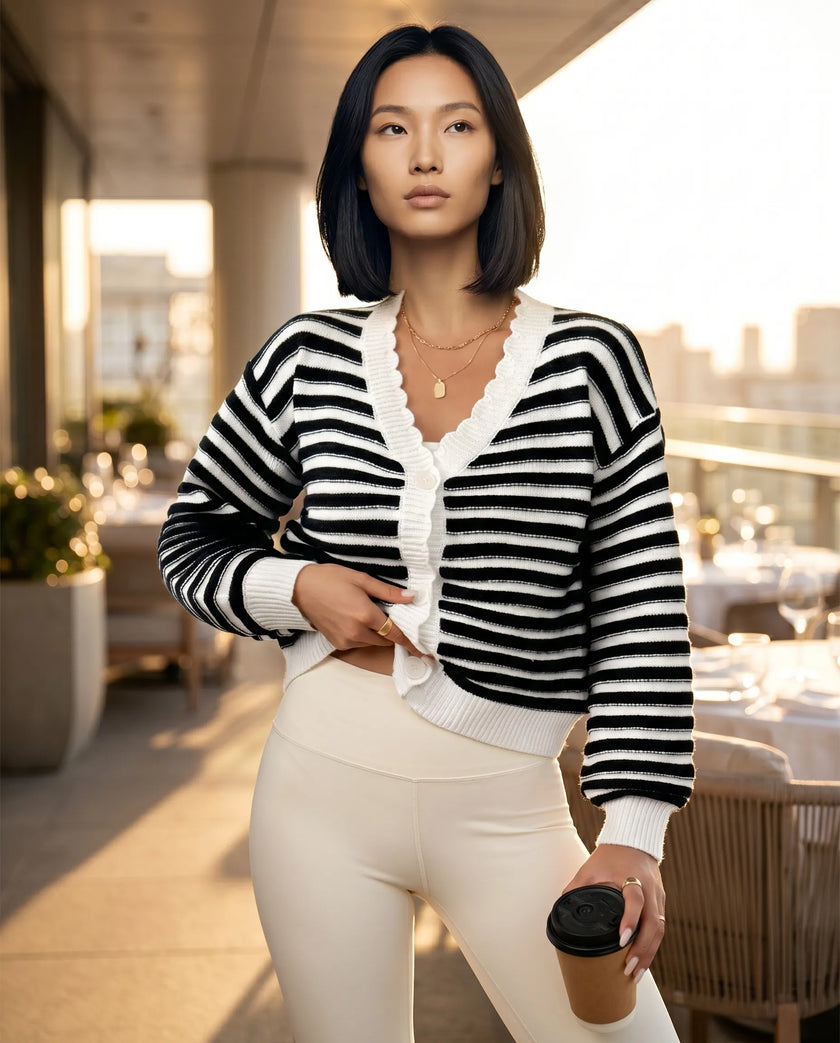 Lifestyle view of black cropped cardigan layered over activewear for elevated casual styling