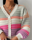 Closeup of multicolor striped knit texture and balloon sleeve detail on cropped cardigan