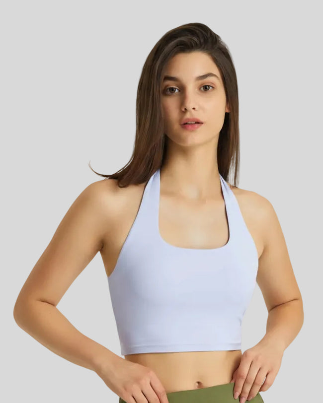 Angled front view of blue halter longline sports bra Earth Core Athlesi