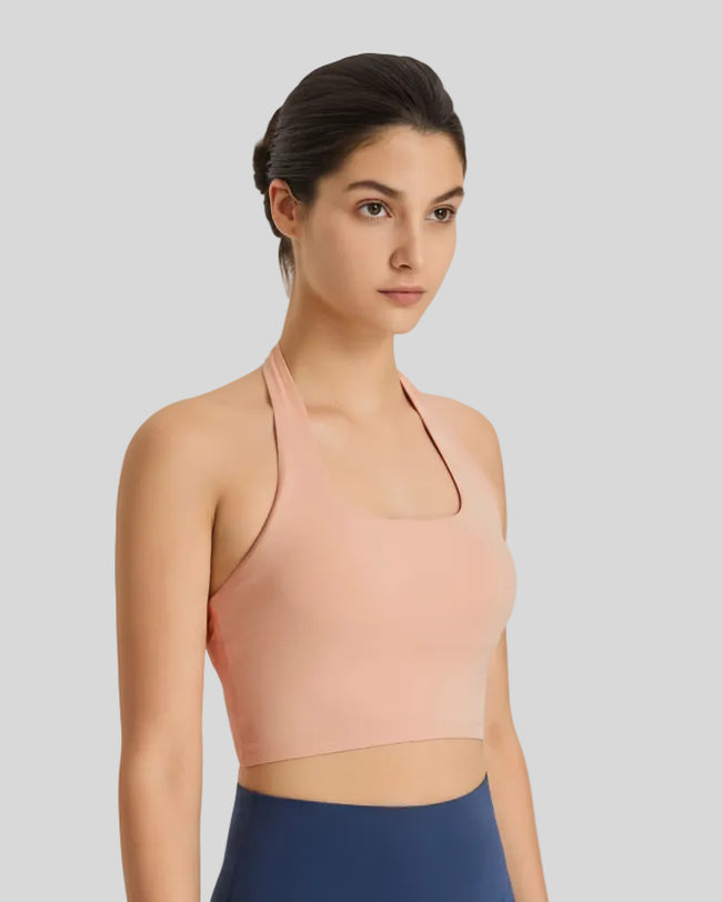 Angled front view of nude halter longline sports bra Earth Core Athlesi