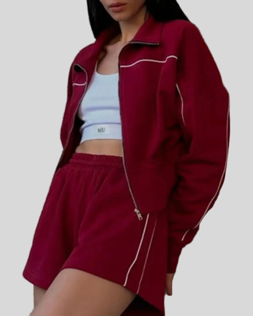 Close-up of Athlesi burgundy TrackEase jacket with contrast piping detail