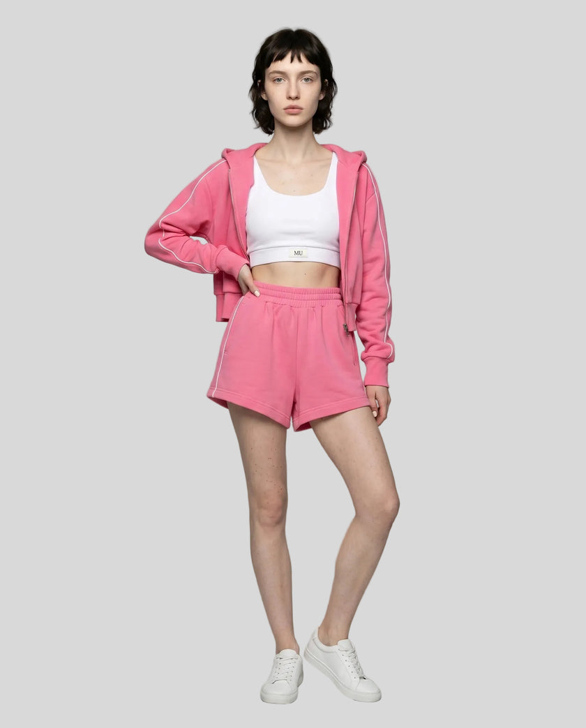 Model wearing Athlesi hot pink TrackEase jacket and shorts set full body front