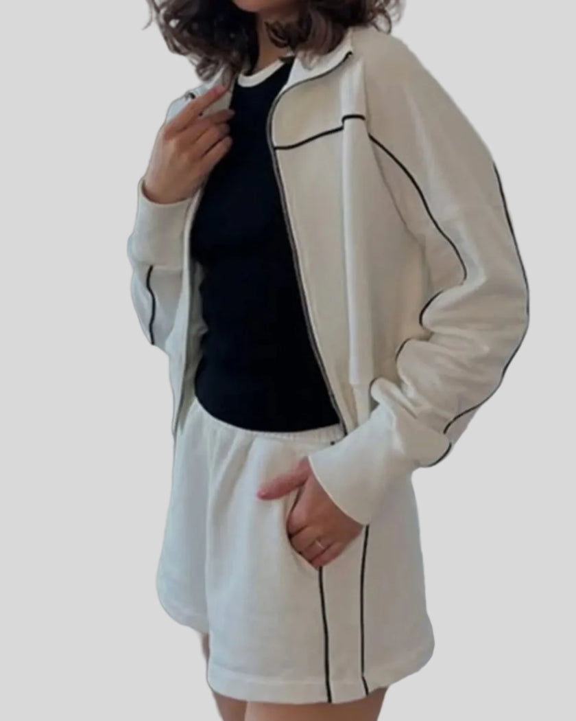 Side view of Athlesi ivory TrackEase jacket and shorts set