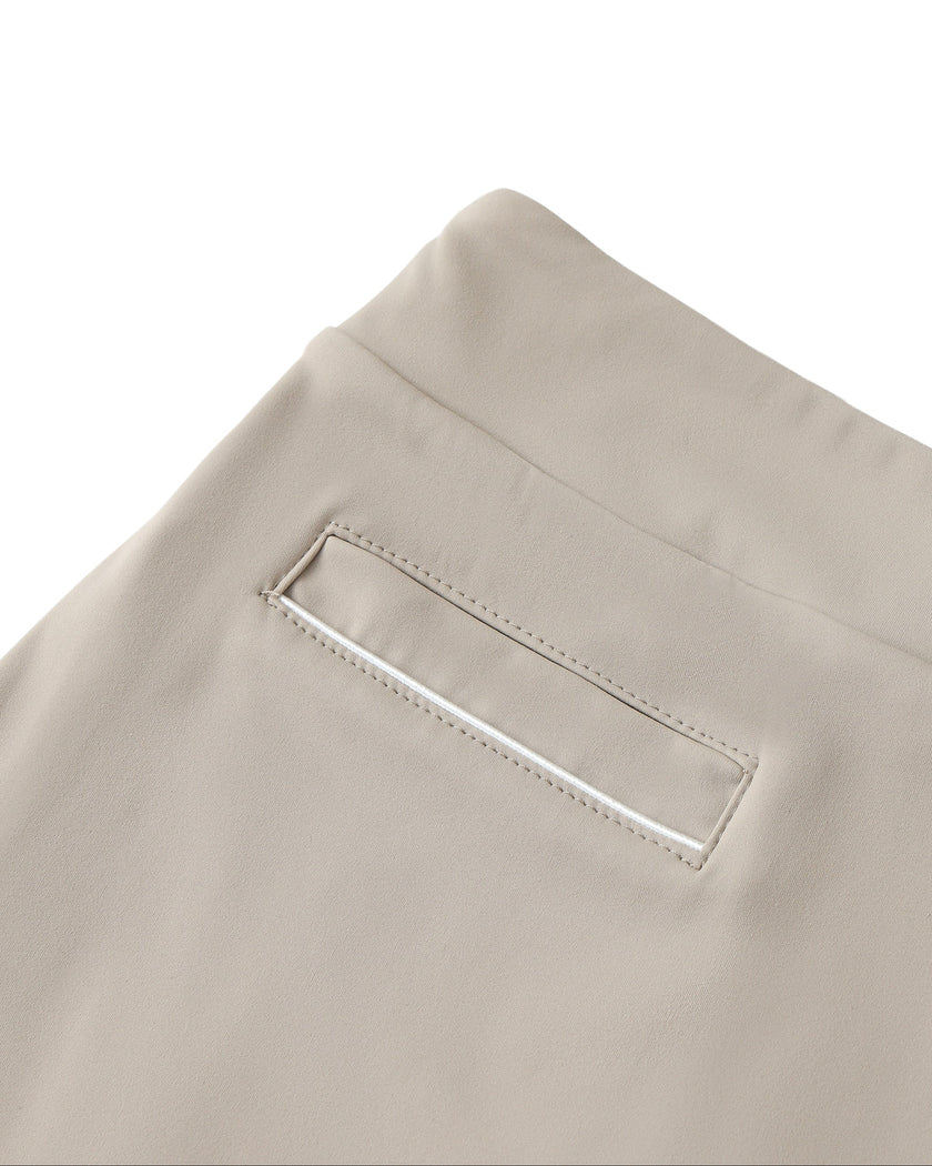 Stretch pocket detail closeup of the Athlesi TrackLine A-Line Skirt in light coffee