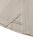 Wrap slit detail closeup of the Athlesi TrackLine A-Line Skirt in light coffee