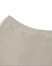 Back waistband detail closeup of the Athlesi TrackLine A-Line Skirt in light coffee