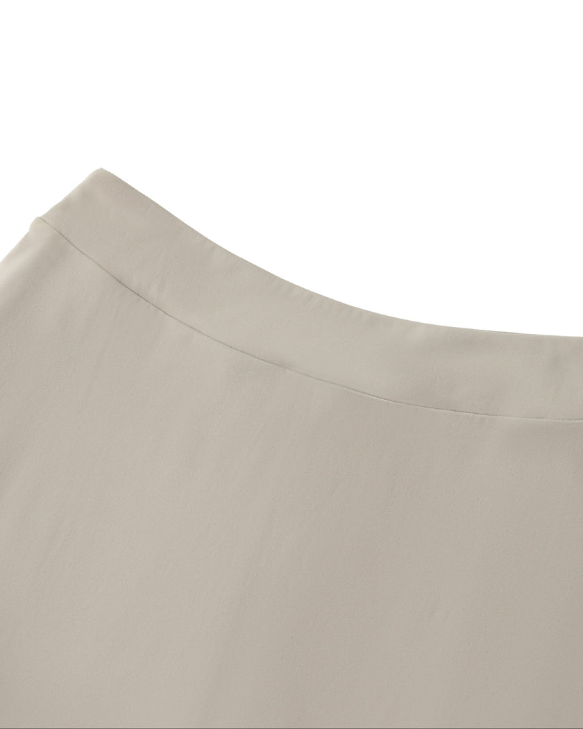 Back waistband detail closeup of the Athlesi TrackLine A-Line Skirt in light coffee