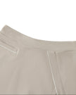 Front waistband closeup of the Athlesi TrackLine A-Line Skirt in light coffee