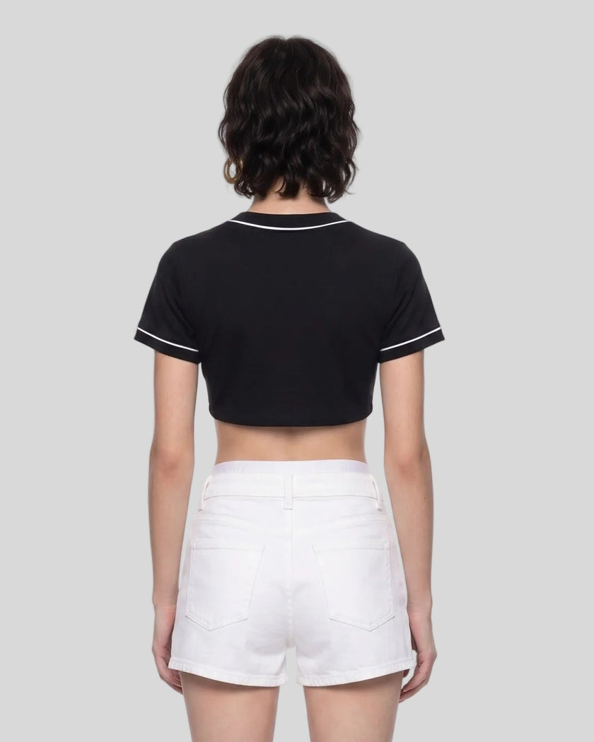Woman wearing the TrackLine Baseball Jersey in Black from the back showing its cropped silhouette and contrast sleeve trim