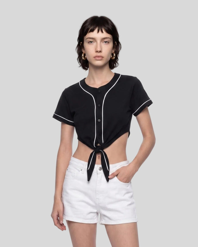 Woman wearing the TrackLine Baseball Jersey in Black tied at the front with a cropped casual fit