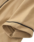 Sleeve close-up of TrackLine Baseball Jersey in Coffee showing contrast piping along the short sleeve hem