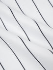 Close-up of the white and black pinstripe fabric on the Athlesi TrackLine Baseball Striped Shorts