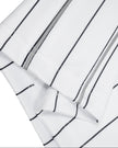 Close-up of the straight leg hem on the Athlesi TrackLine Baseball Striped Shorts