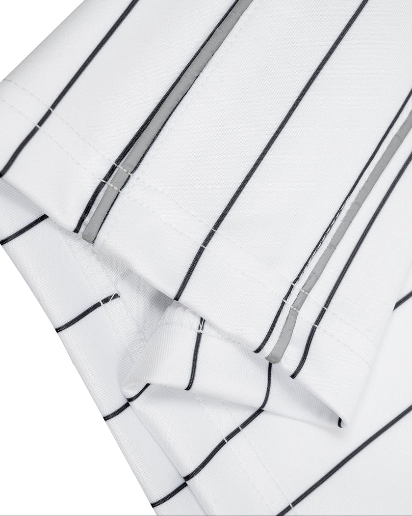 Close-up of the straight leg hem on the Athlesi TrackLine Baseball Striped Shorts