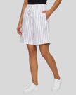 Model wearing the Athlesi TrackLine Baseball Striped Shorts in white from a front angle