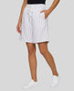 Model wearing the Athlesi TrackLine Baseball Striped Shorts in white from a front angle