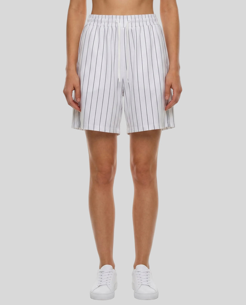 Model wearing the Athlesi TrackLine Baseball Striped Shorts in white, front view