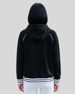 Model wearing TrackLine Club Hoodie in Black back view