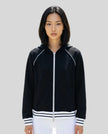 Model wearing TrackLine Club Hoodie in Black fully zipped front view