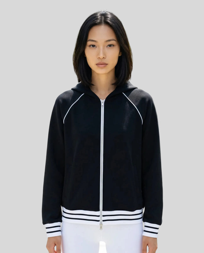 Model wearing TrackLine Club Hoodie in Black fully zipped front view