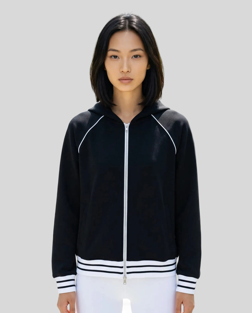 Model wearing TrackLine Club Hoodie in Black fully zipped front view