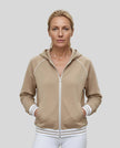 Model wearing TrackLine Club Hoodie in Khaki fully zipped front view
