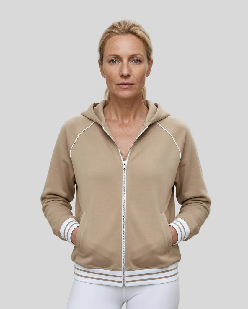 Model wearing TrackLine Club Hoodie in Khaki fully zipped front view
