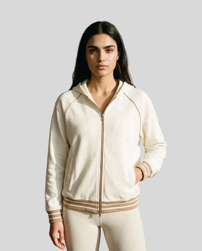 Model wearing TrackLine Club Hoodie in Mild Apricot fully zipped front view
