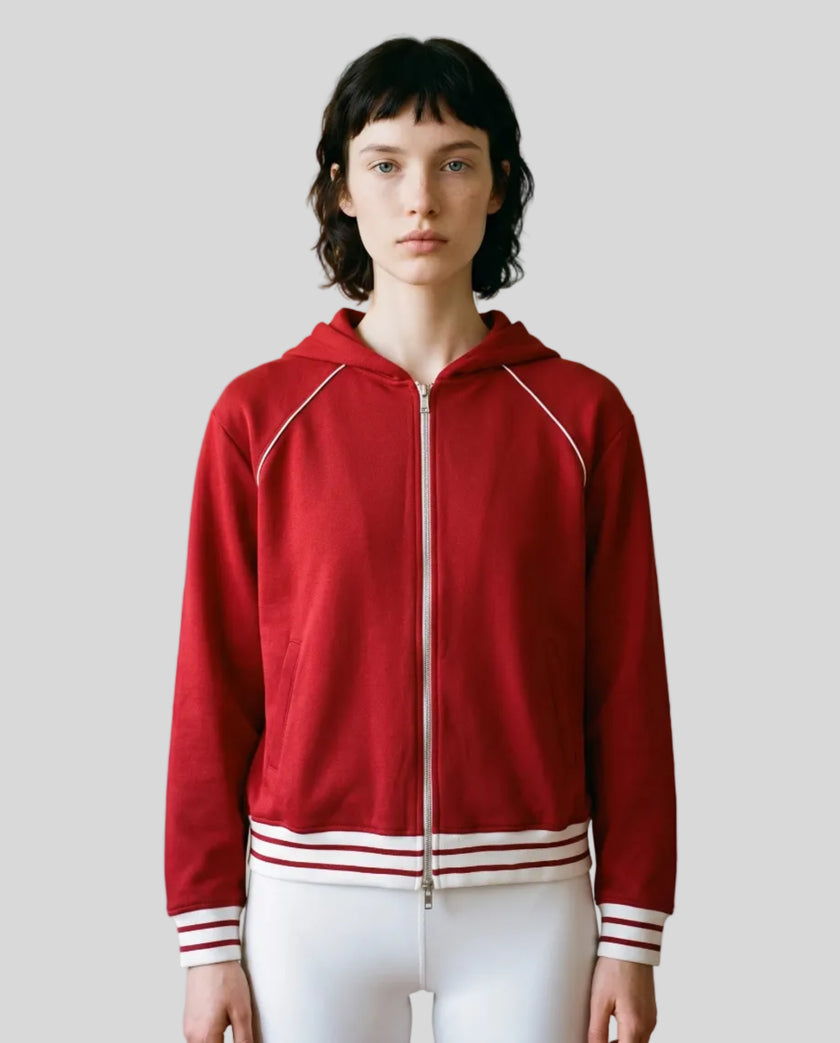 Model wearing TrackLine Club Hoodie in Red fully zipped front view