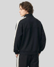 Woman Model wearing TrackLine Club Jacket in Black back view