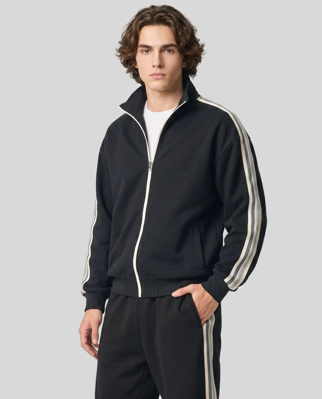 Model wearing TrackLine Club Jacket in Black angled front view