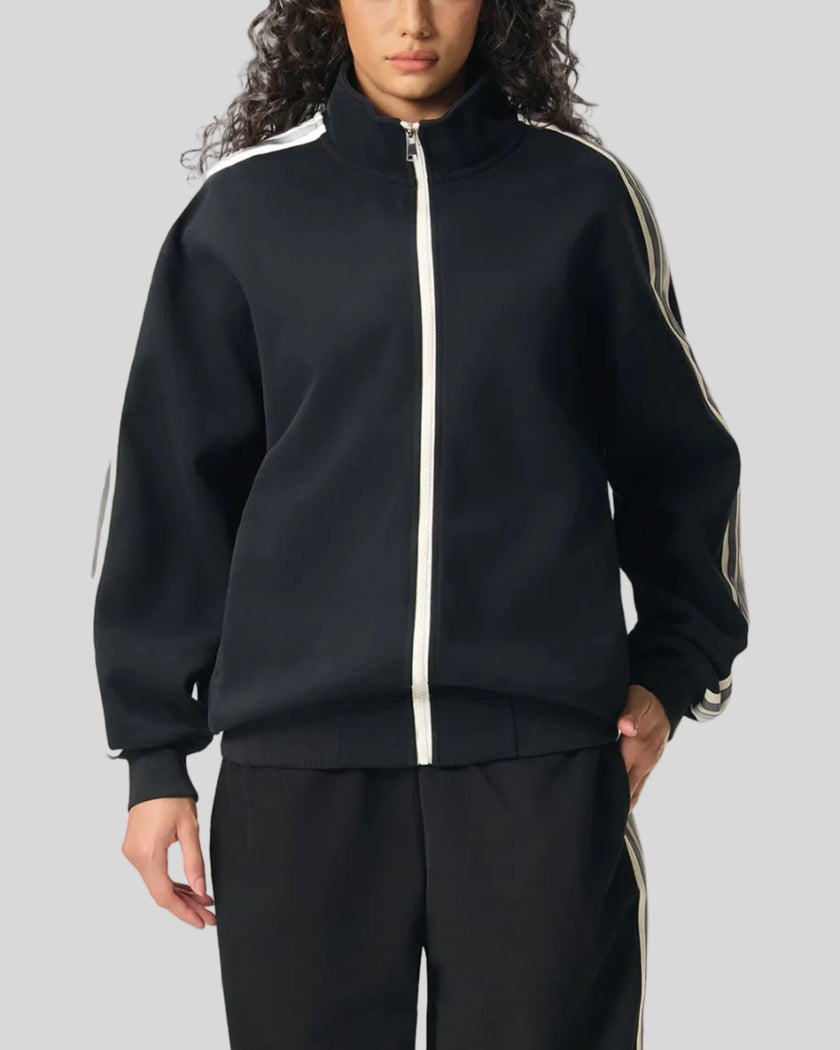 Model wearing TrackLine Club Jacket in Black fully zipped front view